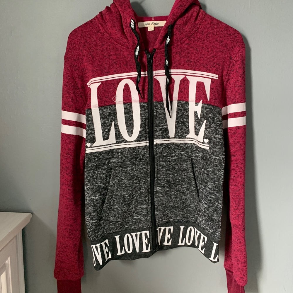 Multi color sweater with the words love